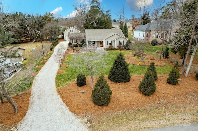 view of front of home featuring a front yard and covered porch