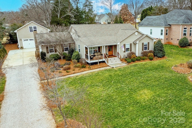 view of front of home with a porch, a garage, and a front lawn