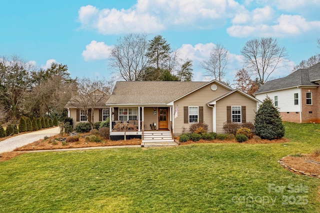 ranch-style home with covered porch and a front lawn