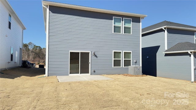 back of house with central AC and a patio area