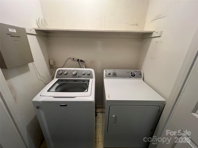 washroom with independent washer and dryer