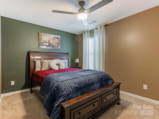 bedroom with light carpet, a ceiling fan, visible vents, and baseboards