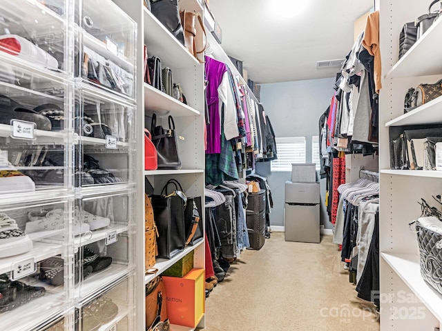 walk in closet with carpet and visible vents