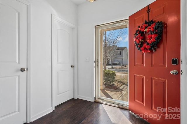 foyer with dark hardwood / wood-style flooring