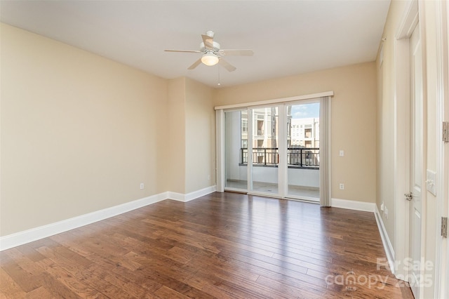 empty room with dark wood-type flooring and ceiling fan