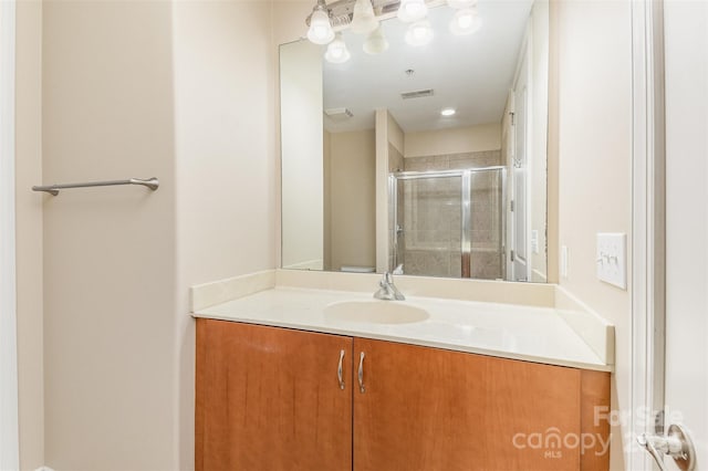 bathroom featuring vanity and walk in shower