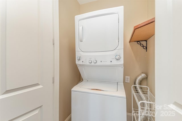 laundry area featuring stacked washing maching and dryer