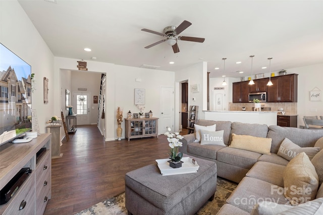 living room with recessed lighting, baseboards, dark wood finished floors, and a ceiling fan