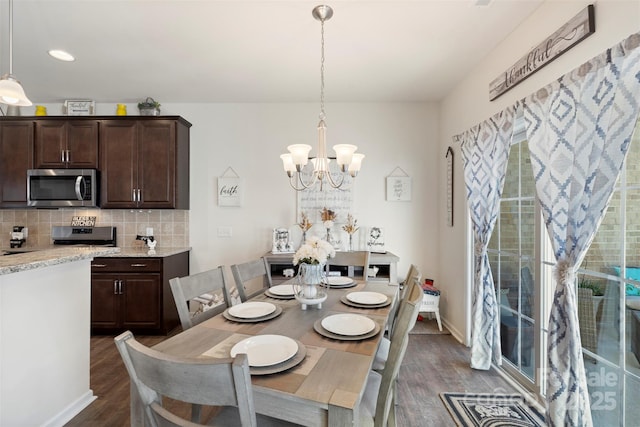 dining area featuring a notable chandelier, recessed lighting, baseboards, and dark wood-style flooring