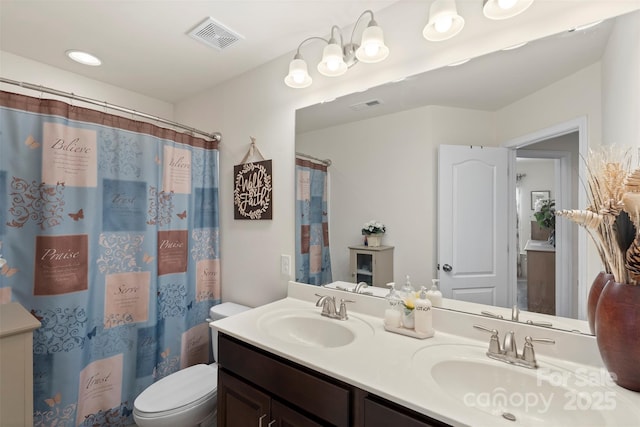 full bathroom with a sink, visible vents, and toilet