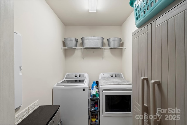 laundry room with washer and dryer and cabinet space