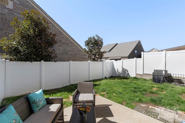 view of yard with a fenced backyard, an outdoor living space, and a patio