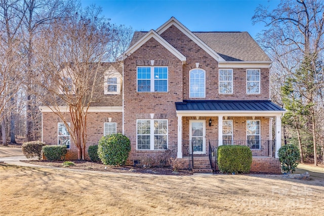 view of front of property with a front yard and covered porch