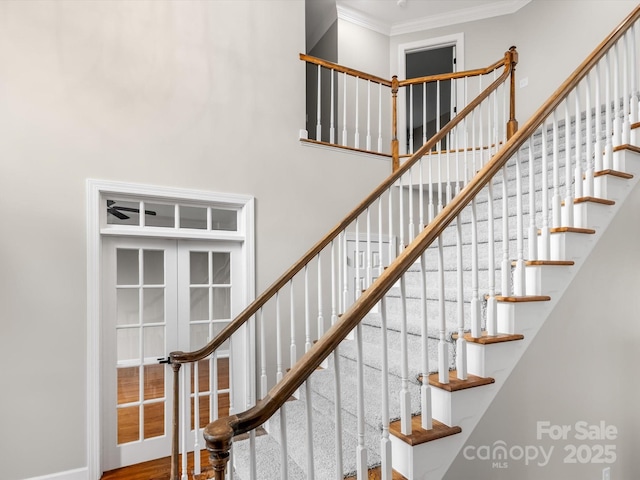 staircase featuring crown molding