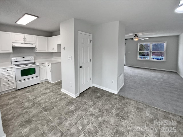 kitchen featuring electric stove, white cabinetry, ceiling fan, and carpet