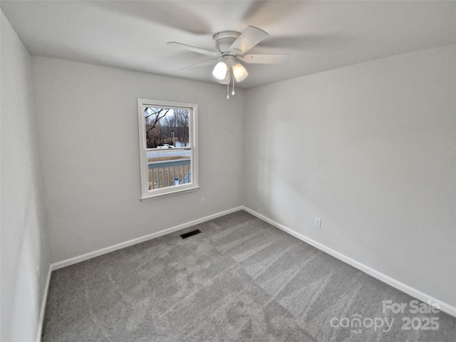 carpeted empty room with ceiling fan