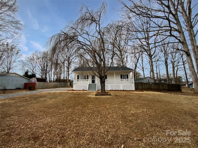 back of property with a lawn