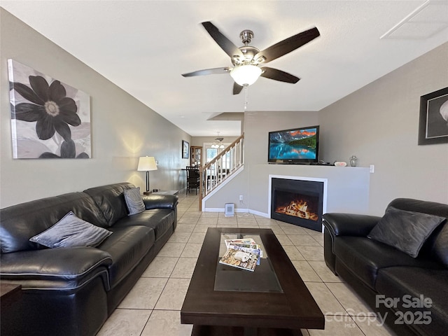 tiled living room with ceiling fan