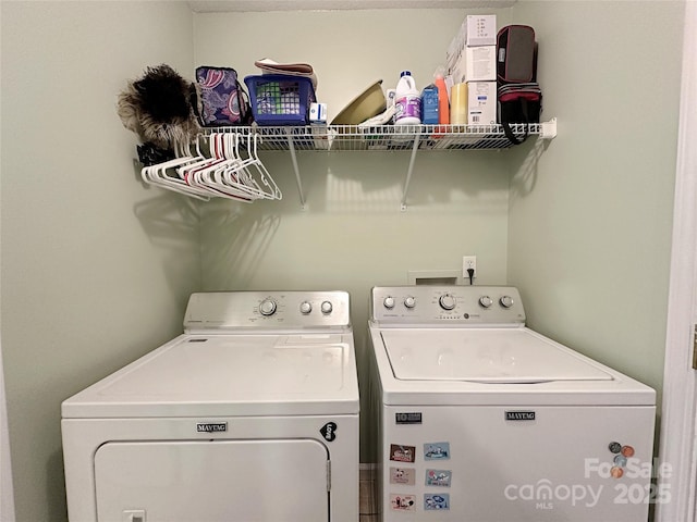 clothes washing area featuring washer and dryer