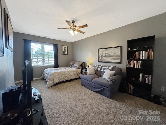 bedroom with ceiling fan and carpet