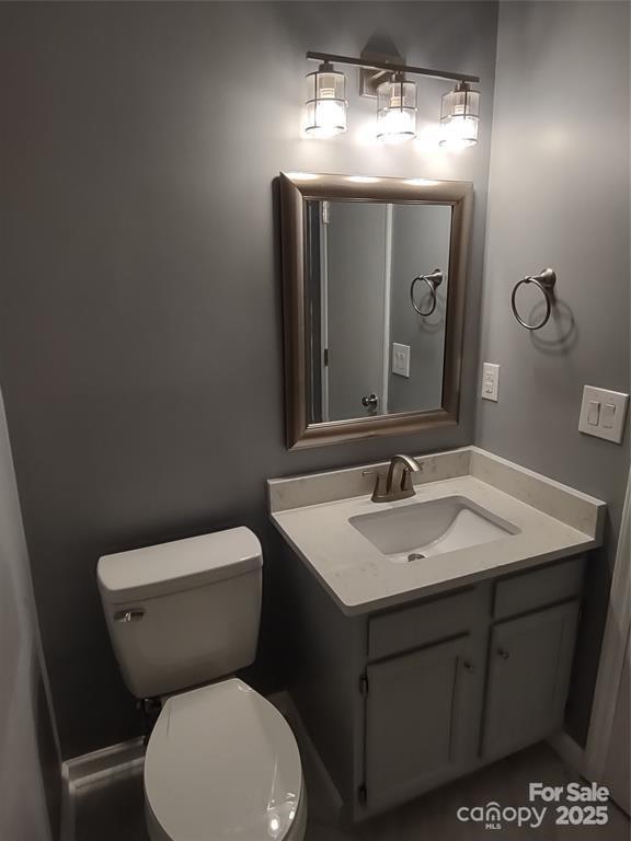 bathroom featuring vanity and toilet