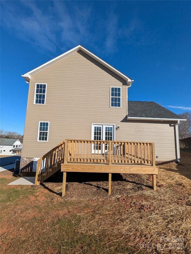 back of property featuring a wooden deck