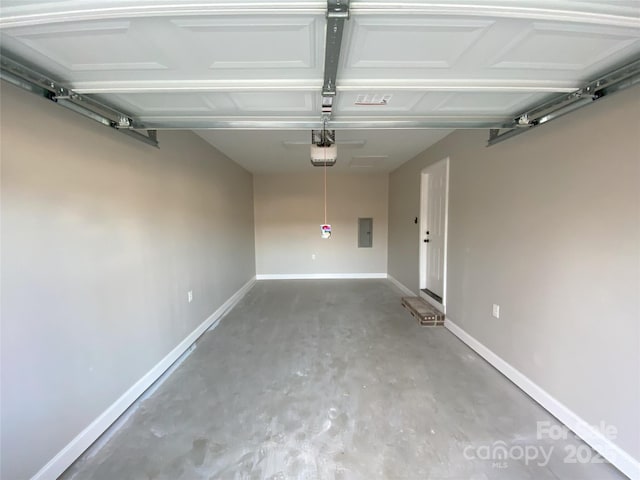 garage with electric panel and baseboards