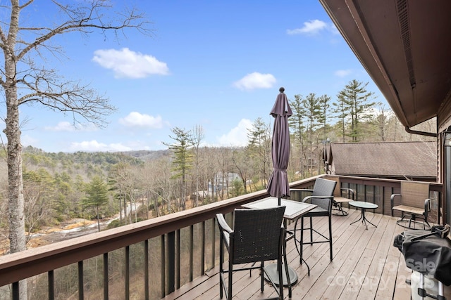 deck featuring a wooded view