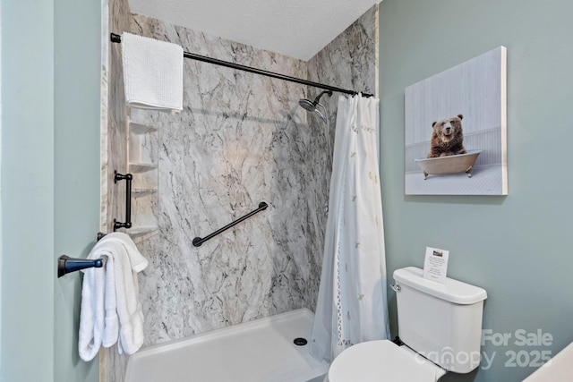 bathroom with toilet, a textured ceiling, and a shower with shower curtain