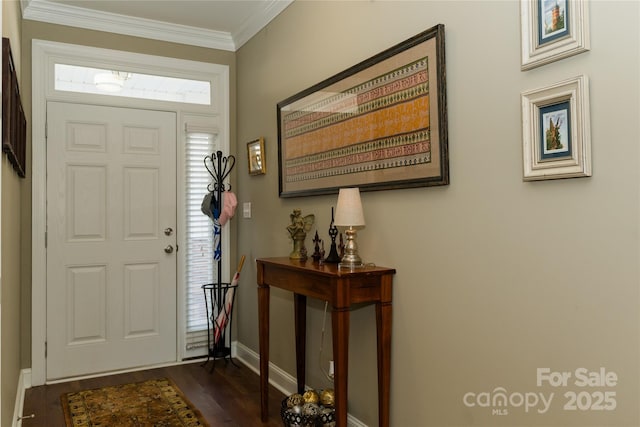 entrance foyer with dark wood-type flooring and ornamental molding