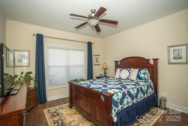 bedroom featuring dark hardwood / wood-style flooring and ceiling fan