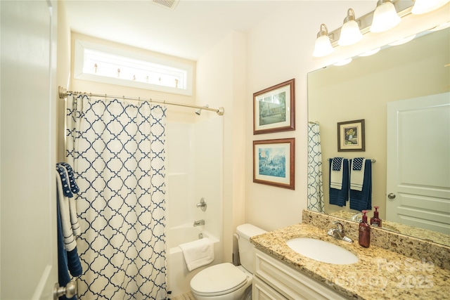 full bathroom with vanity, shower / bath combination with curtain, and toilet