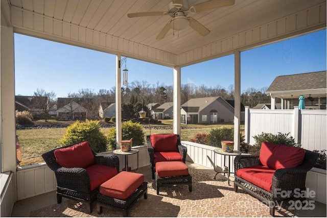 sunroom / solarium featuring ceiling fan and wooden ceiling