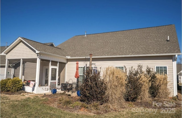 back of house featuring a sunroom