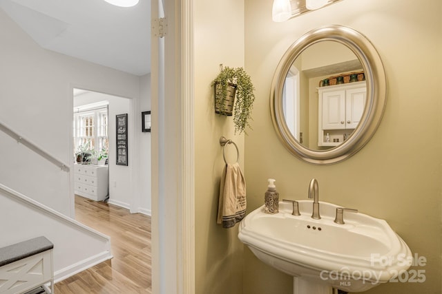 bathroom with sink and hardwood / wood-style flooring