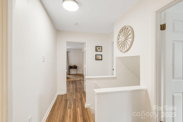 corridor featuring wood-type flooring