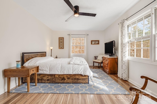 bedroom featuring ceiling fan and hardwood / wood-style floors