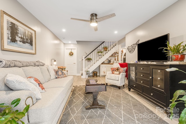 living room with ceiling fan and wood-type flooring