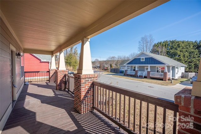 wooden terrace with a porch