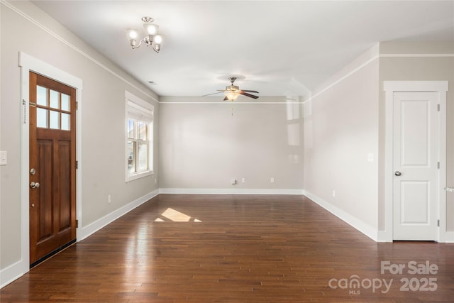 foyer with dark hardwood / wood-style flooring and ceiling fan with notable chandelier