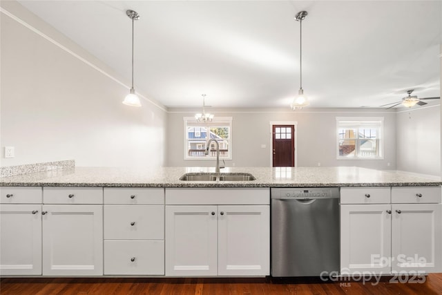 kitchen with sink, white cabinets, hanging light fixtures, and dishwasher