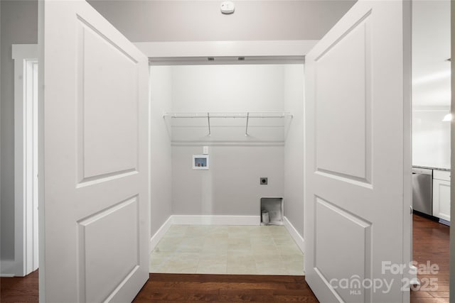 clothes washing area with hookup for a washing machine, light hardwood / wood-style flooring, and hookup for an electric dryer