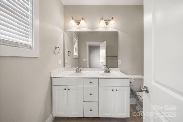 bathroom with vanity and toilet