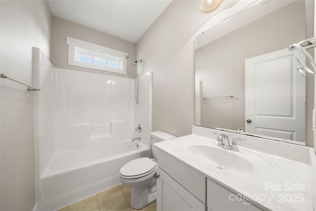 full bathroom with tile patterned flooring, bathing tub / shower combination, vanity, and toilet