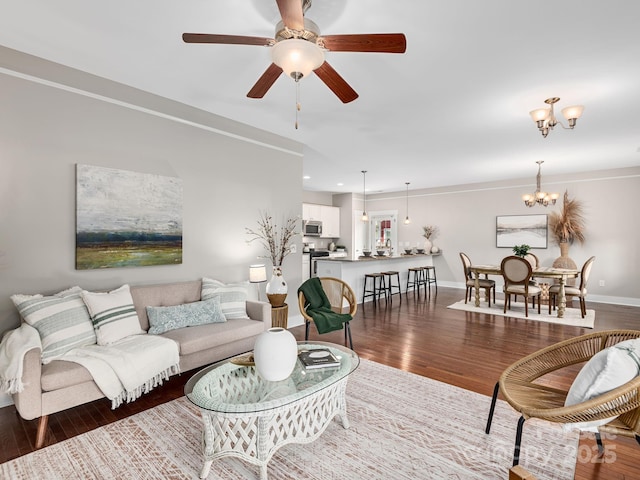 9 Hyde Park Pl, Arden, NC 28704 - living room with wood finished floors, baseboards, recessed lighting, ceiling fan, and a chandelier