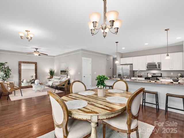 9 Hyde Park Pl, Arden, NC 28704 - dining area with a chandelier, a ceiling fan, dark wood finished floors, and recessed lighting