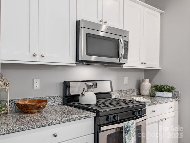 9 Hyde Park Pl, Arden, NC 28704 - kitchen featuring appliances with stainless steel finishes, white cabinets, and stone counters