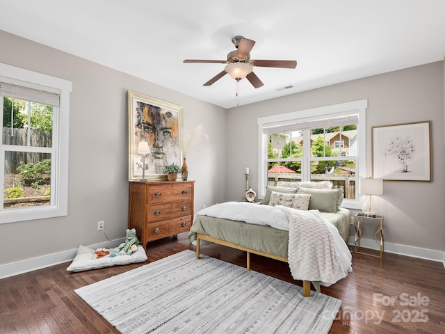 9 Hyde Park Pl, Arden, NC 28704 - bedroom with multiple windows, baseboards, and hardwood / wood-style floors