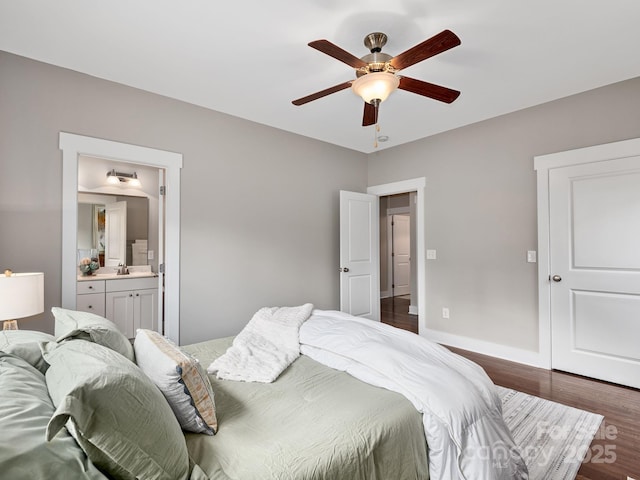 9 Hyde Park Pl, Arden, NC 28704 - bedroom featuring dark wood-style flooring, a sink, connected bathroom, baseboards, and ceiling fan
