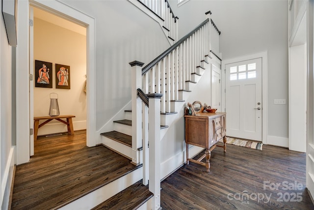 foyer entrance featuring dark hardwood / wood-style flooring